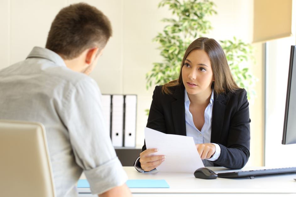 Office workers having a meeting reviewing paperwork