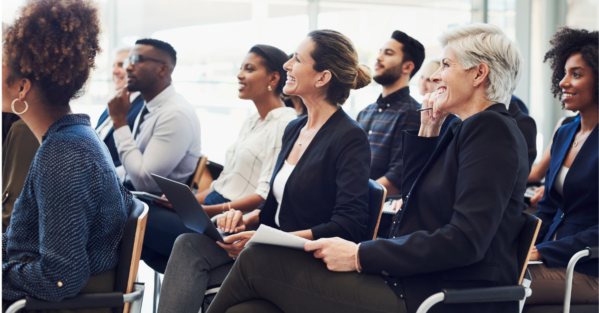 Audience looking at speaker at a conference