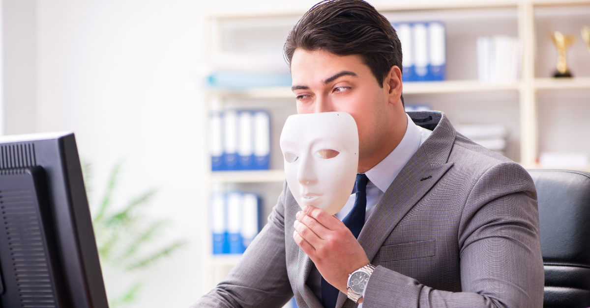 Man hiding behind mask
